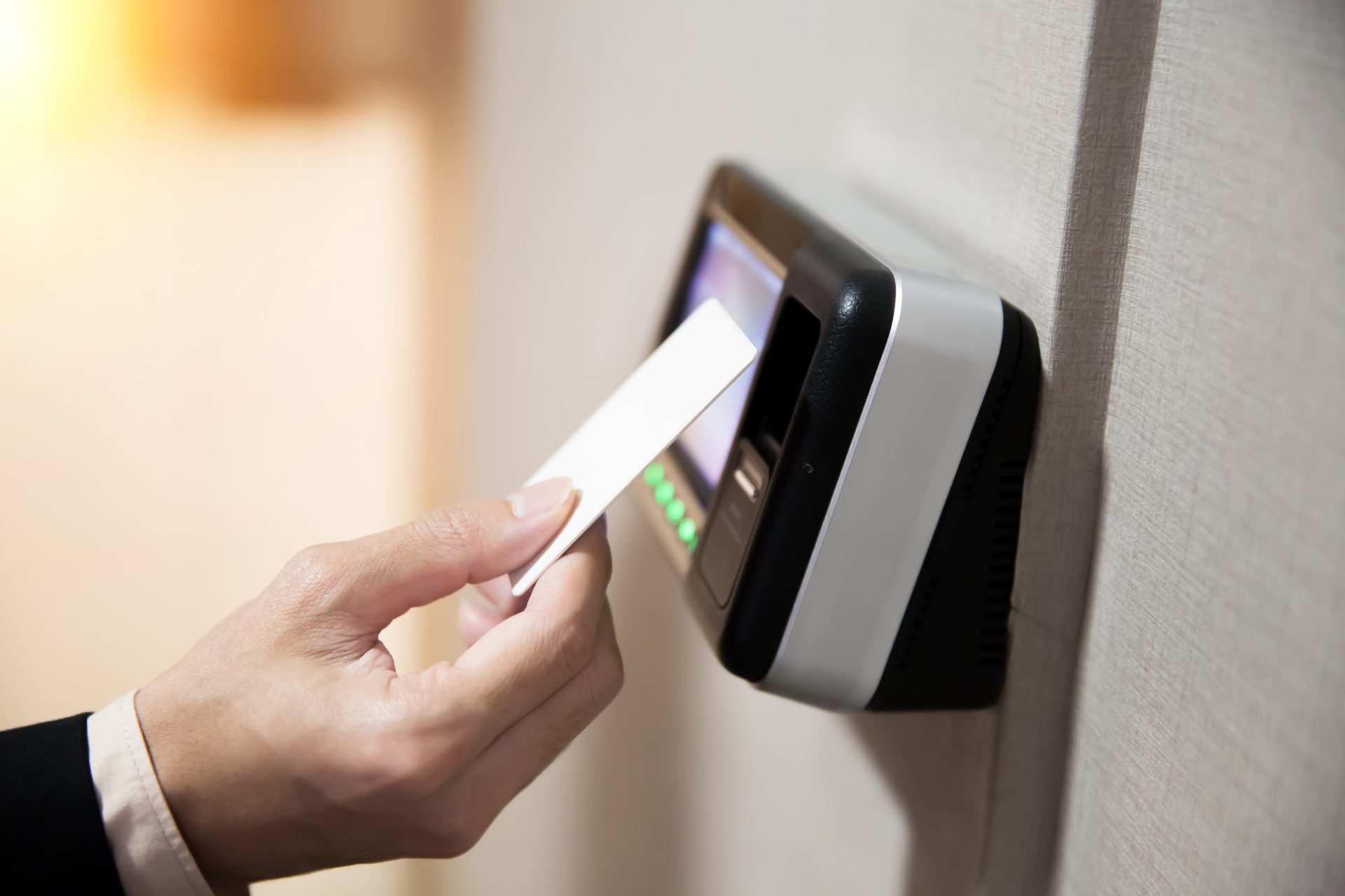 close-up-of-hand-using-keycard-to-open-the-door